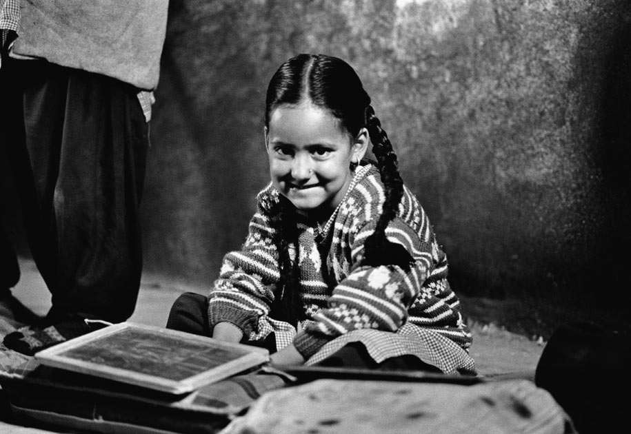 03_schoolgirl.spiti.studying.blackand white.slate.india.jpg